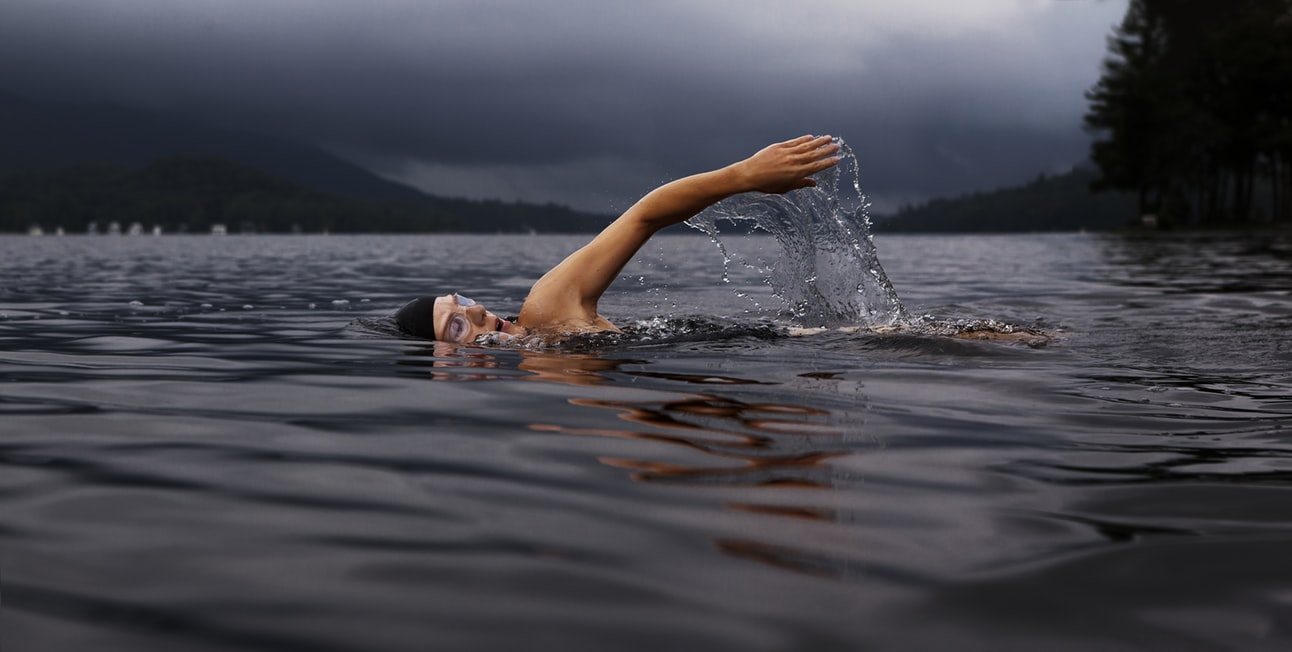 An image of a man swimming, which can symbolize grief, loss, bereavement, or grieving- sometimes we need to just keep swimming.