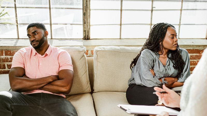 A couple struggles to connect during a session of marriage coaching.
